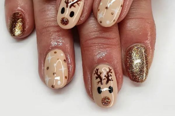 Nude and glitter gold Christmas nails